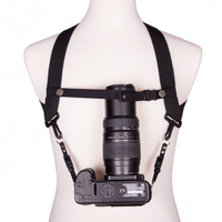 My Fave Camera Harness Chest Strap holding a long lens upright