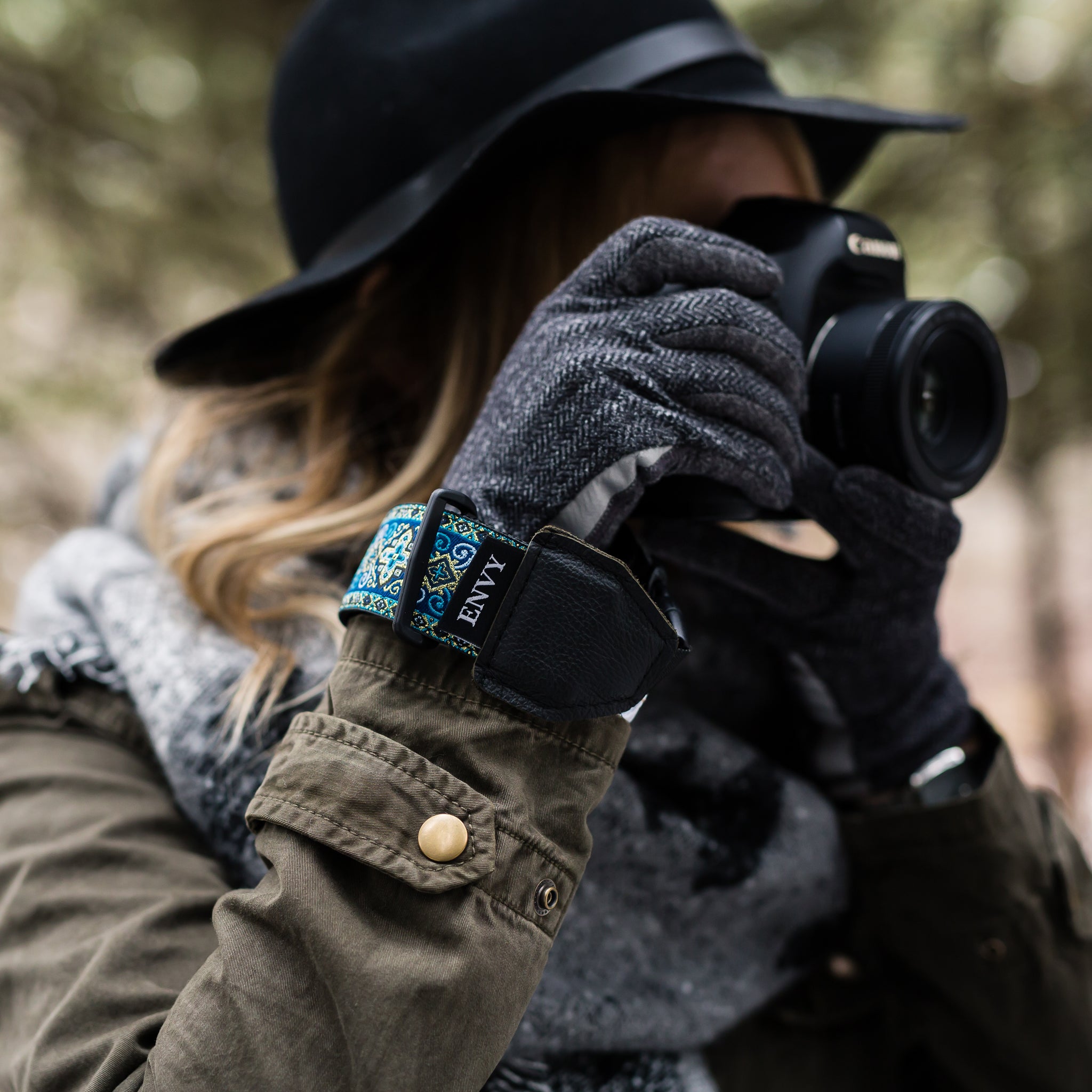Image of a photographer using a My Fave Camera Wrist Strap